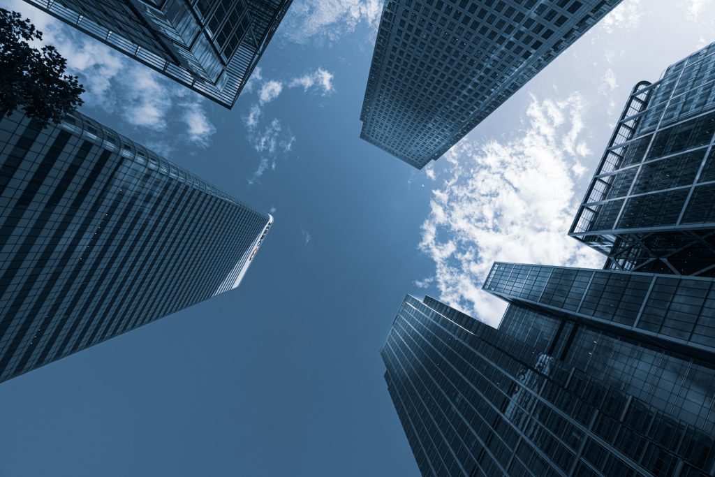 Looking up at glass towers in Canary Wharf, London